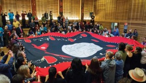 The button blanket receiving its inaugural dance at UVic's First Peoples House (Photo Services)