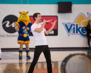 Music student Josh Lovell belts out the Vikes Rally Song before a game (photo: Armando Tura)