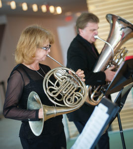 Joan playing alongside her husband, Scott Irvine