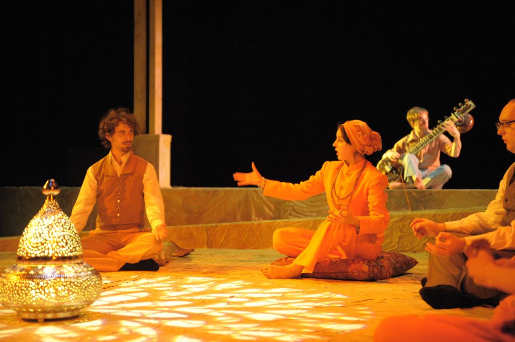 Duke Orsino (Liam Volke) gets a lesson in meditation from his swami Viola disguised as Cesario (Sarah Koury) while serenaded by a sitar player (Andrew Gillott).  Photo: David Lowes. 