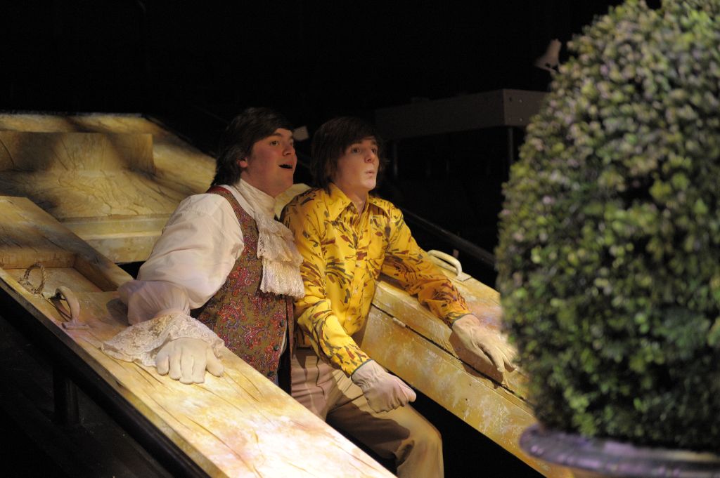 An awesomely clad Sir Toby (Cobi Dayan) and Sir Andrew (Lucas Hall) hide behind the shrubbery as the hatch their prank to get revenge on Malvolio.  Photo: David Lowes. 