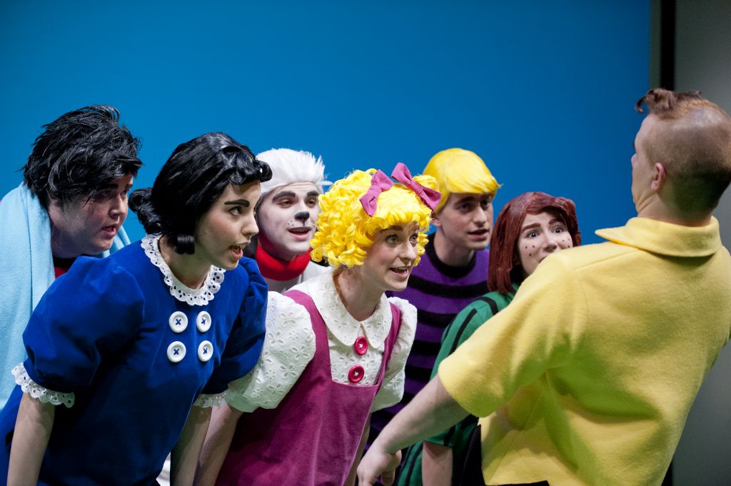 The Peanut gang, including Lucy (Tea Siskin), Snoopy (Kevin Eade), Sally Brown (Christie Stewart), Schroeder (Derek Wallis) and Peppermint Patty (Véronique Piercy), sing “You’re a Good Man, Charlie Brown” to Charlie (Kale Penny). Photo by David Lowes. 